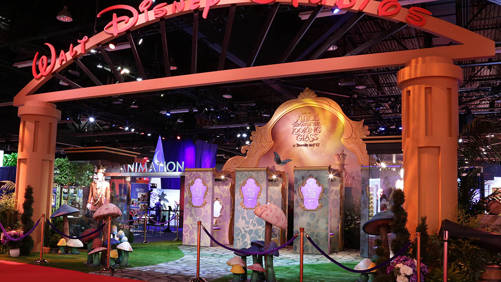 Guests using the Alice Wonder Mirror facial-tracking booth at Disney's D23