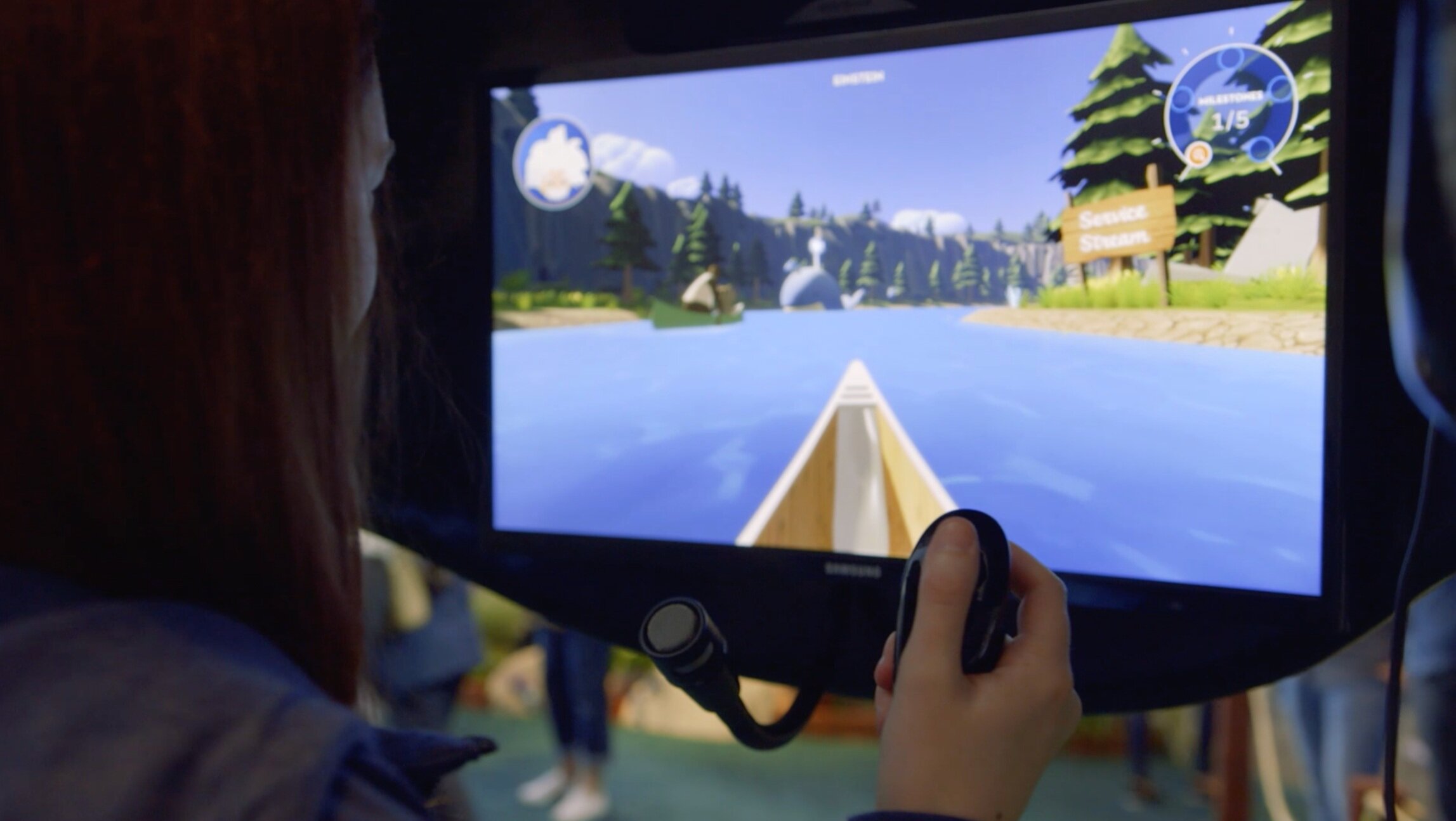 A guest steering the canoe portal by voice on an interactive kiosk