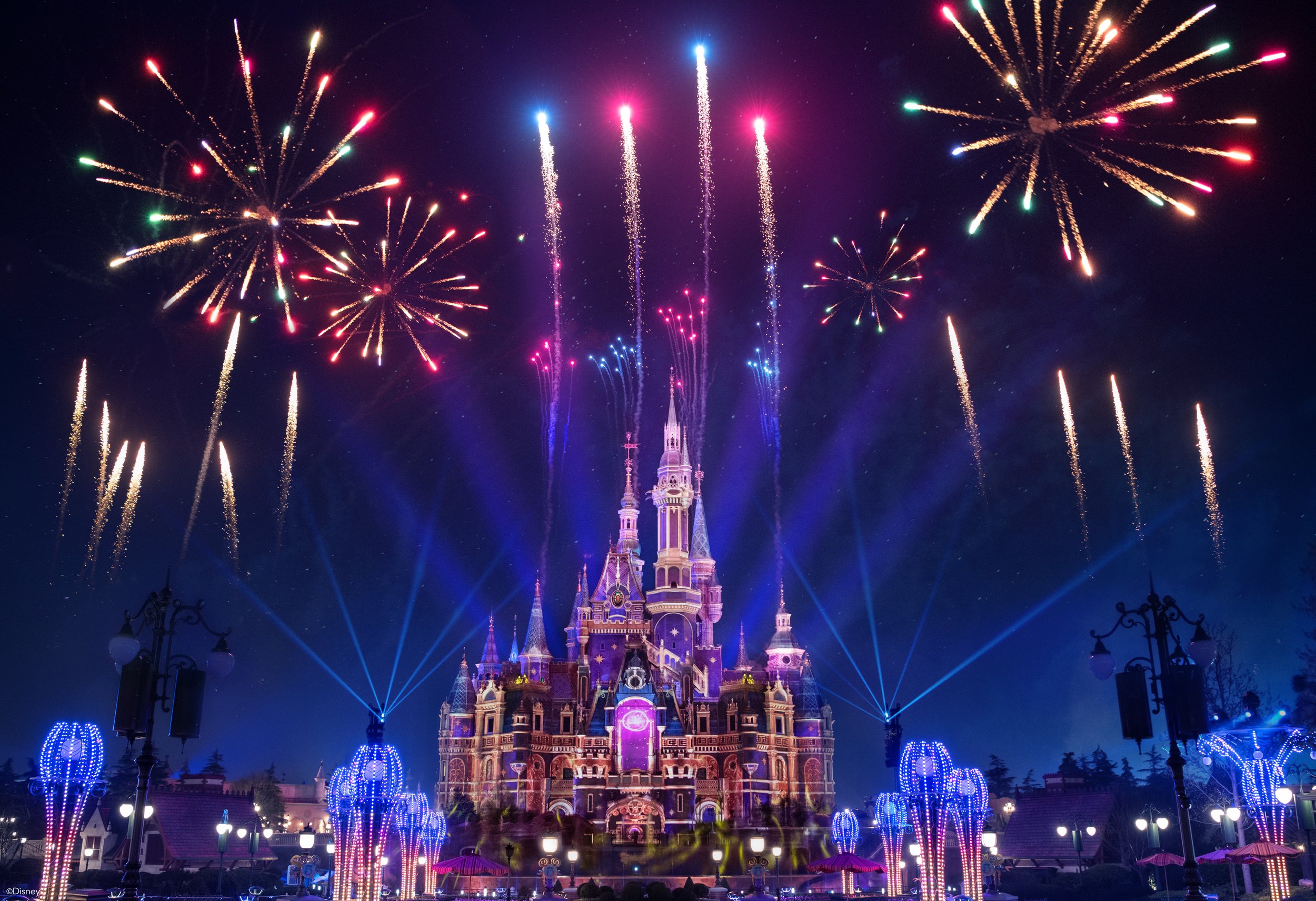 Blue and violet projection mapping on the castle with fireworks