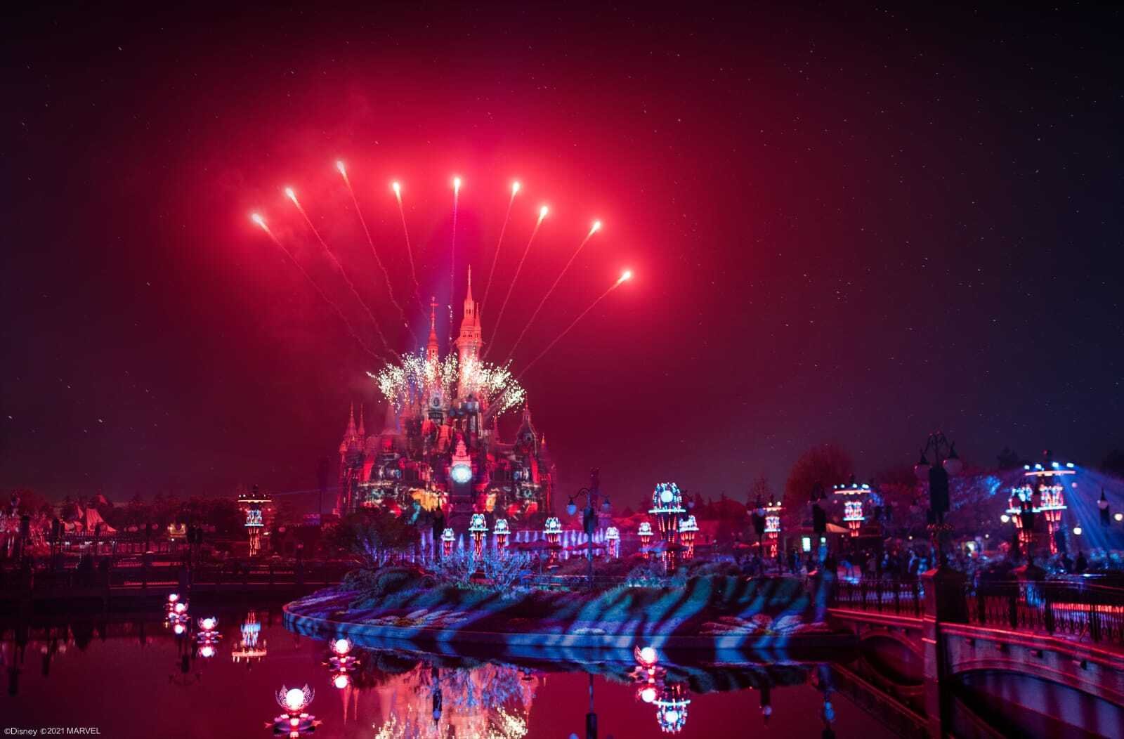 Red fireworks finale over the castle and moat