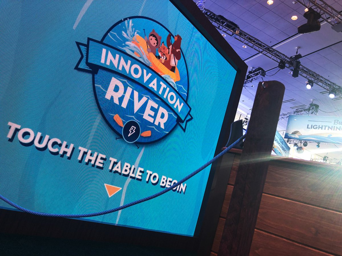 Wide shot of the Innovation River installation on the show floor