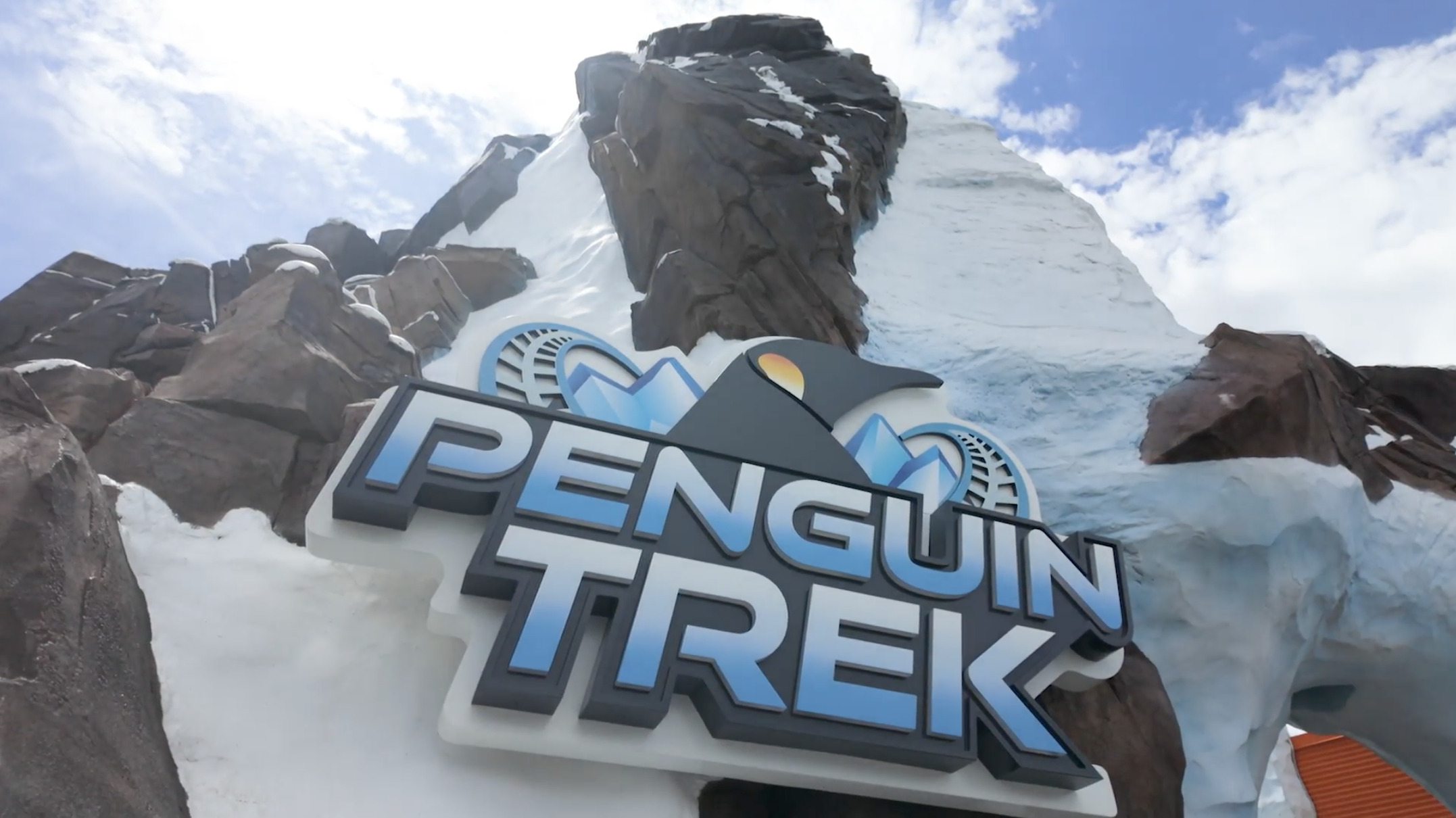 Themed Penguin Trek signage at the attraction entrance