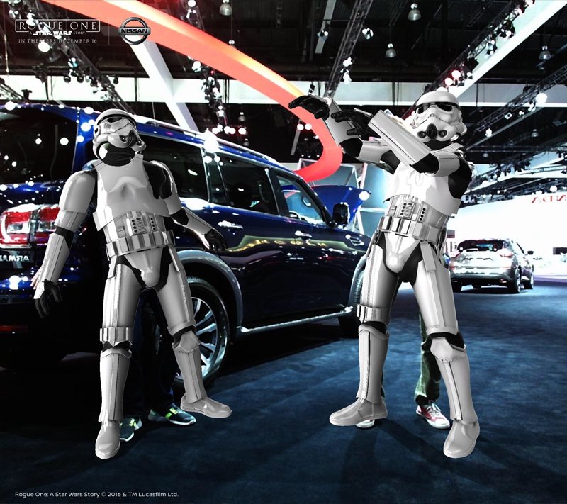 Two guests transformed into Stormtroopers posing next to the Nissan Rogue