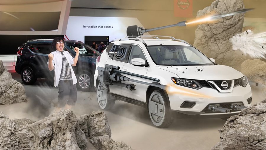AR composite of a guest cheering next to the weaponized Battle Test Rogue amid rocky terrain
