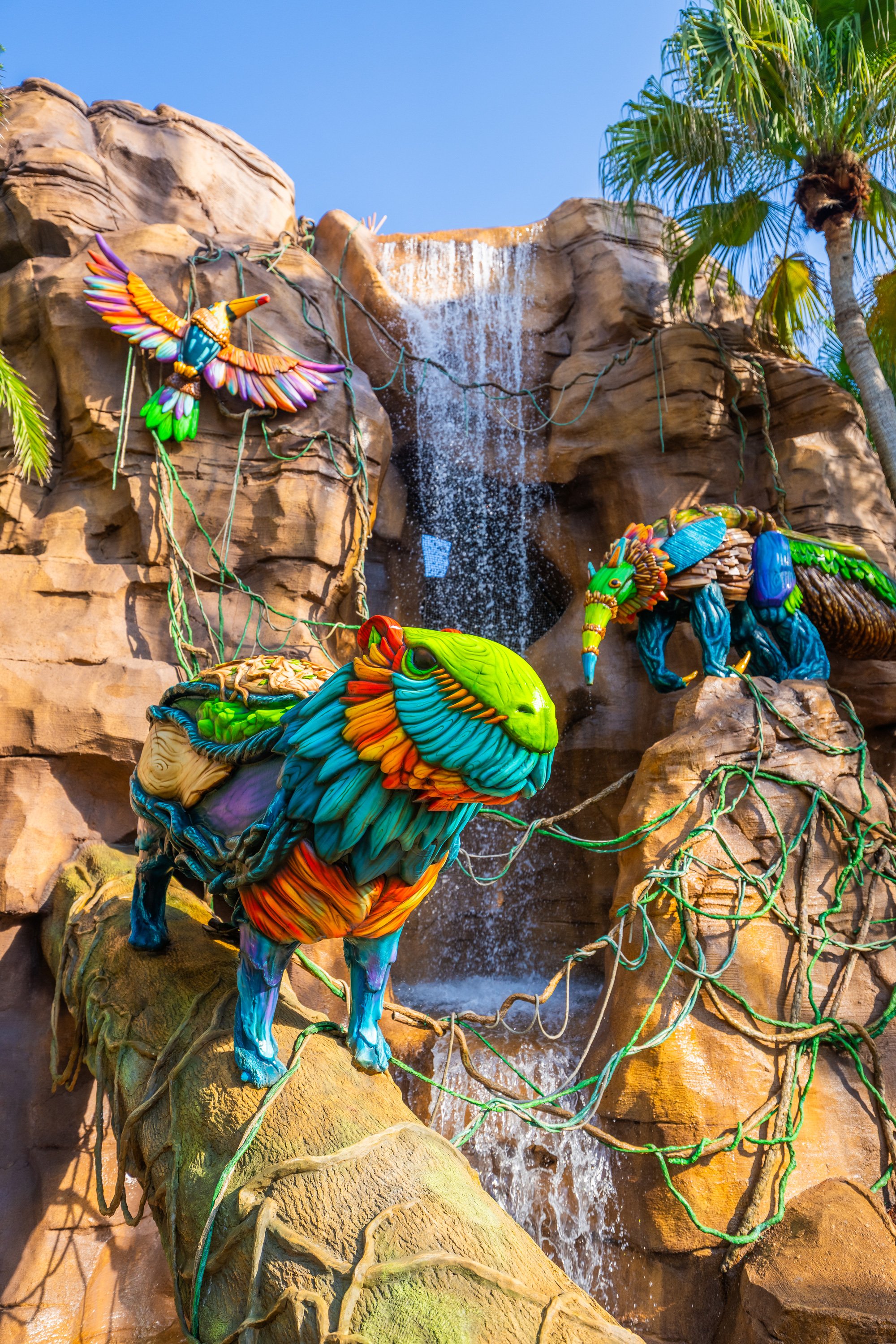 Waterfall and creature sculptures at the Wild Oasis realm